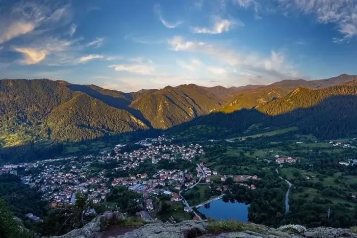 Framed Print : View from high rock to old village Smolyan with green meadows for cattle walking and houses Framed Print : View from high rock to old village Smolyan with green meadows for cattle walking and houses