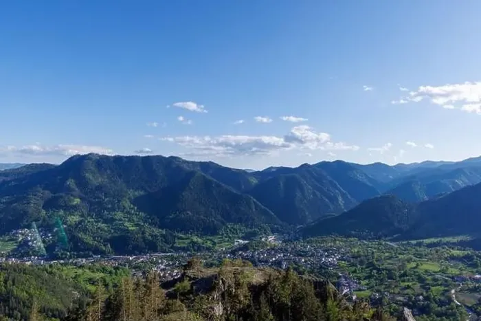 Framed Print : View from high rock to old village town of Smolyan with green meadows for cattle walking and ancient houses