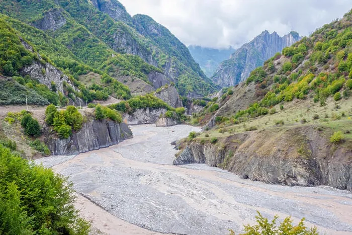 Framed Print : View over Lahich river bed torrent and vertical rocks in summer, Azerbaijan Framed Print : View over Lahich river bed torrent and vertical rocks in summer, Azerbaijan