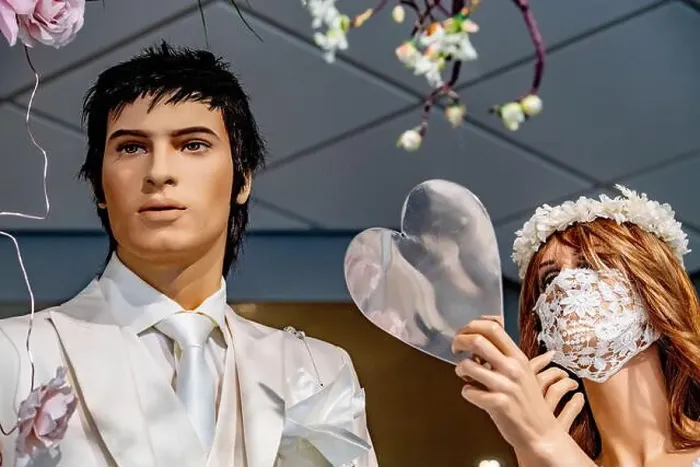 Framed Print : A view a male and female mannequins dressed in bridal wear with the female mannequin wearing a laced bridal facemask Framed Print : A view a male and female mannequins dressed in bridal wear with the female mannequin wearing a laced bridal facemask