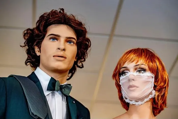 Framed Print : A view male and female mannequins dressed in bridal wear with the female mannequin wearing a laced bridal facemask Framed Print : A view male and female mannequins dressed in bridal wear with the female mannequin wearing a laced bridal facemask
