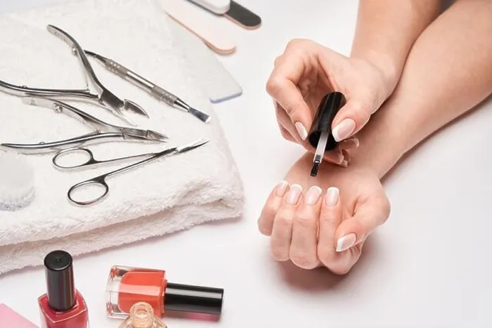 Framed Print : top view of manicure tools set for nail care over light background - brush, scissors, nail polish, file and tweezers Framed Print : top view of manicure tools set for nail care over light background - brush, scissors, nail polish, file and tweezers