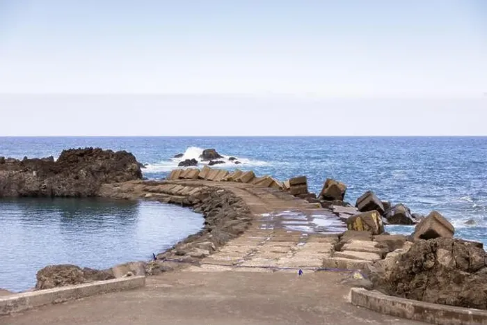 Framed Print : View of the natural pool and Atlantic Ocean separated by a pier in Seixal. Madeira Island, Portugal Framed Print : View of the natural pool and Atlantic Ocean separated by a pier in Seixal. Madeira Island, Portugal