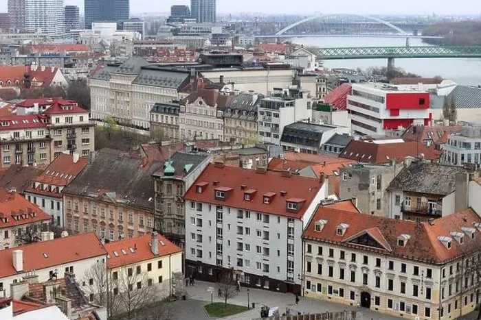 Framed Print : View of the Old Town from the Castle Hill, Bratislava, Slovakia. Street view, old red roofed houses. Spring in Europe Framed Print : View of the Old Town from the Castle Hill, Bratislava, Slovakia. Street view, old red roofed houses. Spring in Europe