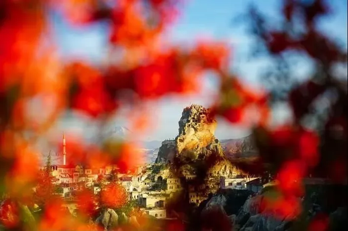 Framed Print : View of the Ortahisar Castle in between the red leaves in Cappadocia Framed Print : View of the Ortahisar Castle in between the red leaves in Cappadocia