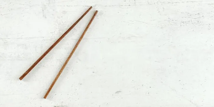 Framed Print : Top down view - pair of dark wood chopsticks on white board Framed Print : Top down view - pair of dark wood chopsticks on white board