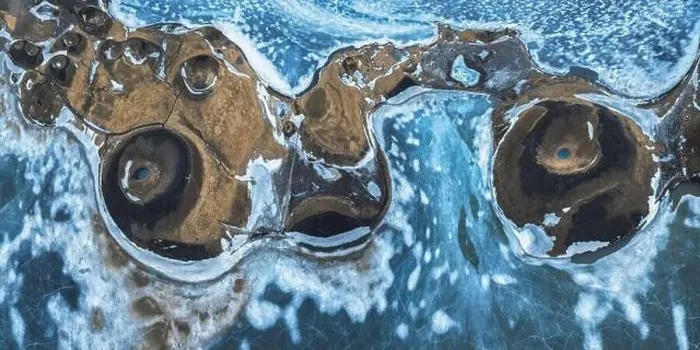 Framed Print : Top view picturesque drone view of Skutustadagigar pseudocraters covered with snow located on shore of Lake Myvatn in Framed Print : Top view picturesque drone view of Skutustadagigar pseudocraters covered with snow located on shore of Lake Myvatn in