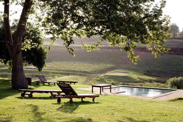 Framed Print : View across the pool at the Alluvia wine estate, Stellenbosch, South Africa Framed Print : View across the pool at the Alluvia wine estate, Stellenbosch, South Africa