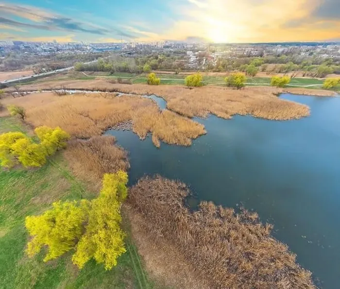 Framed Print : View of the river and the green bank from a height at sunset. Photo from a quadcopter Framed Print : View of the river and the green bank from a height at sunset. Photo from a quadcopter