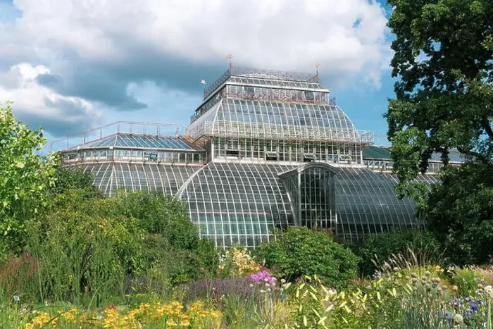 Framed Print : view of the Saint Petersburg Botanical Garden with flower beds and anсient palm greenhouse in the background Framed Print : view of the Saint Petersburg Botanical Garden with flower beds and anсient palm greenhouse in the background