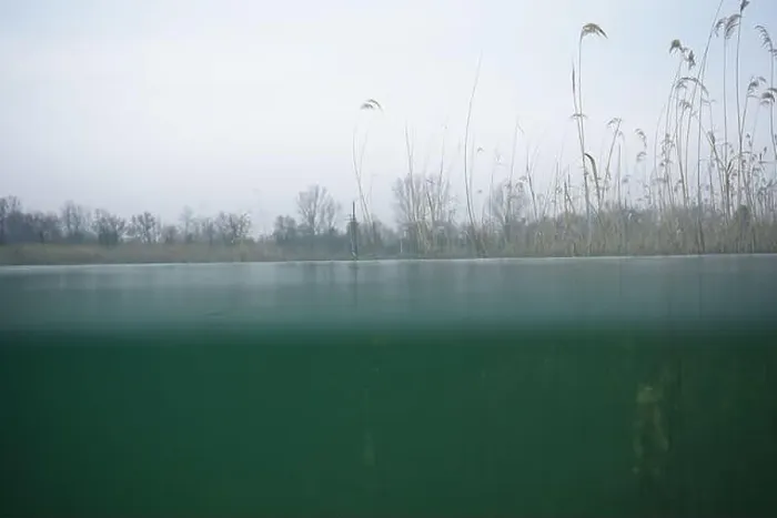 Framed Print : View from a shore shot in a lake nearby