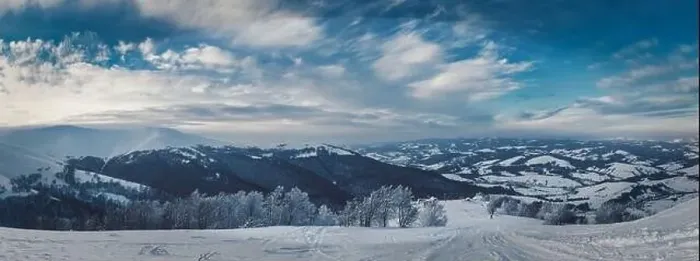 Framed Print : View of the stunning winter panorama of the snowy slopes and hills among the lush white clouds Framed Print : View of the stunning winter panorama of the snowy slopes and hills among the lush white clouds