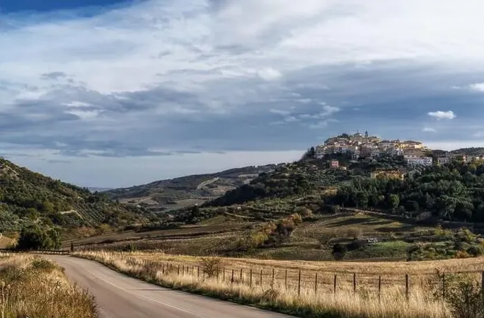 Framed Print : A view of the town of Tolve in Basilicata with a country highway in the foreground Framed Print : A view of the town of Tolve in Basilicata with a country highway in the foreground