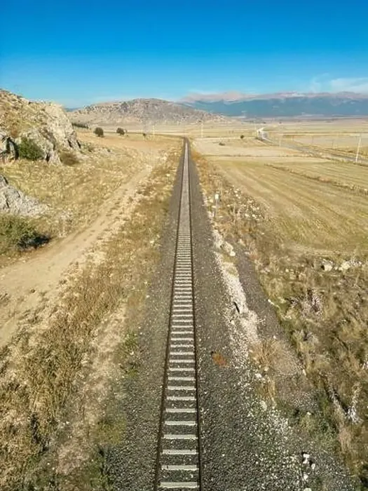 Framed Print : Top view of the train track passing through the arid land, taken with a drone Framed Print : Top view of the train track passing through the arid land, taken with a drone