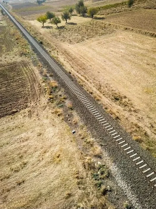 Framed Print : Top view of the train track passing through the arid land, taken with a drone Framed Print : Top view of the train track passing through the arid land, taken with a drone