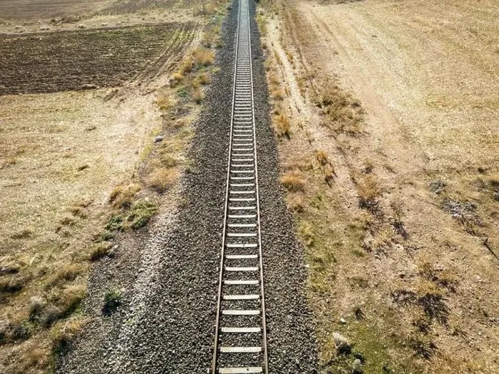 Framed Print : Top view of the train track passing through the arid land, taken with a drone Framed Print : Top view of the train track passing through the arid land, taken with a drone