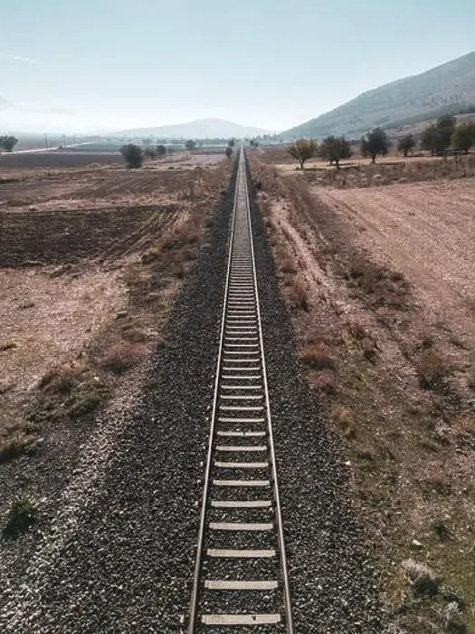 Framed Print : Top view of the train track passing through the arid land, taken with a drone Framed Print : Top view of the train track passing through the arid land, taken with a drone