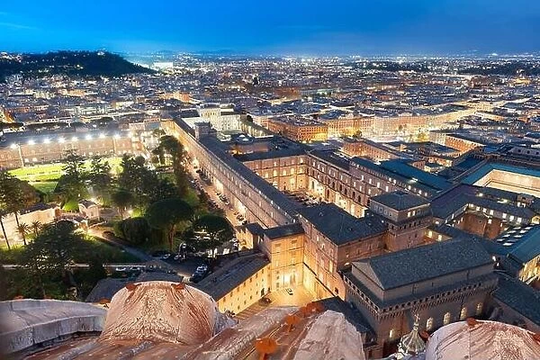 View over Vatican City surrounded by Rome, Italy at night