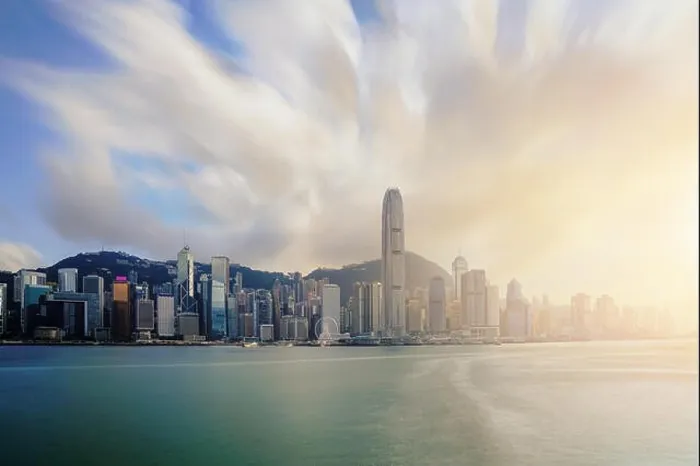 Framed Print : View of Victoria Harbour with Hong Kong skyscraper office buildings at sunset time in Hong Kong. Asia Framed Print : View of Victoria Harbour with Hong Kong skyscraper office buildings at sunset time in Hong Kong. Asia
