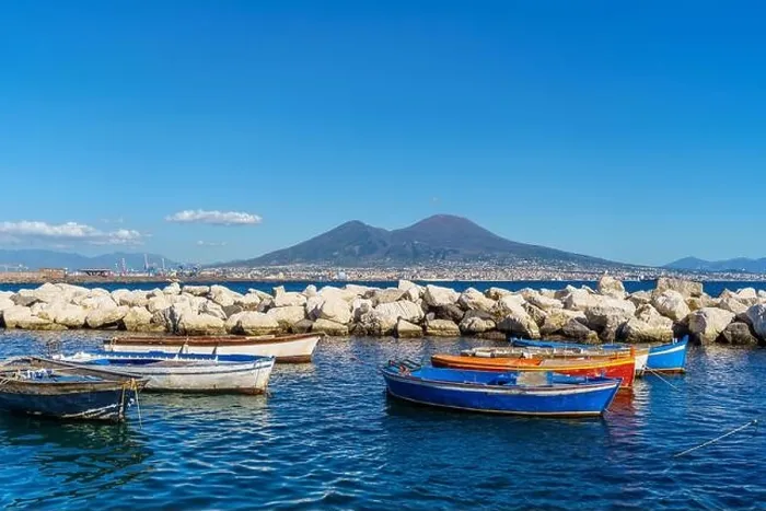 Framed Print : View of Volcano Vesuvius view from seafront with colorful boats in the foreground, Naples, Campania, Italy
