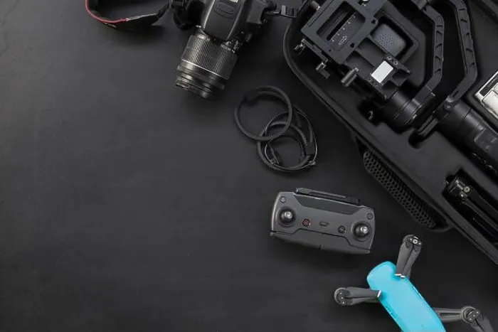Framed Print : top view of work space photographer with digital camera and accessory on black background with copy space. flat lay Framed Print : top view of work space photographer with digital camera and accessory on black background with copy space. flat lay