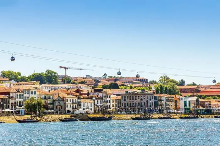 Framed Print : Vila Nova de Gaia, Portugal - May 7, 2021: Cityscape of architecture with many porto wine cellars Framed Print : Vila Nova de Gaia, Portugal - May 7, 2021: Cityscape of architecture with many porto wine cellars