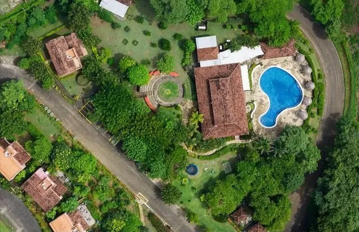 Framed Print : Villa patio with blue pool and green grass above top drone view Framed Print : Villa patio with blue pool and green grass above top drone view