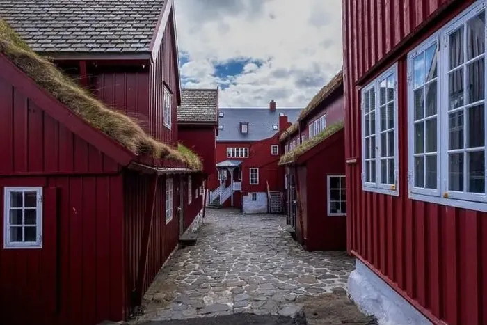 Framed Print : This village with its red houses, white windows, grass rooves and cobbled streets could be straight out of a fairytale Framed Print : This village with its red houses, white windows, grass rooves and cobbled streets could be straight out of a fairytale