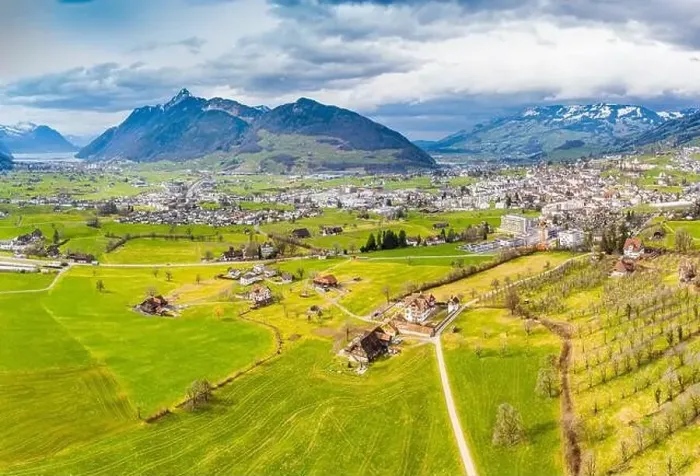 Framed Print : Village in Switzerland. Canton of Schwyz. Panorama aerial view from a drone Framed Print : Village in Switzerland. Canton of Schwyz. Panorama aerial view from a drone