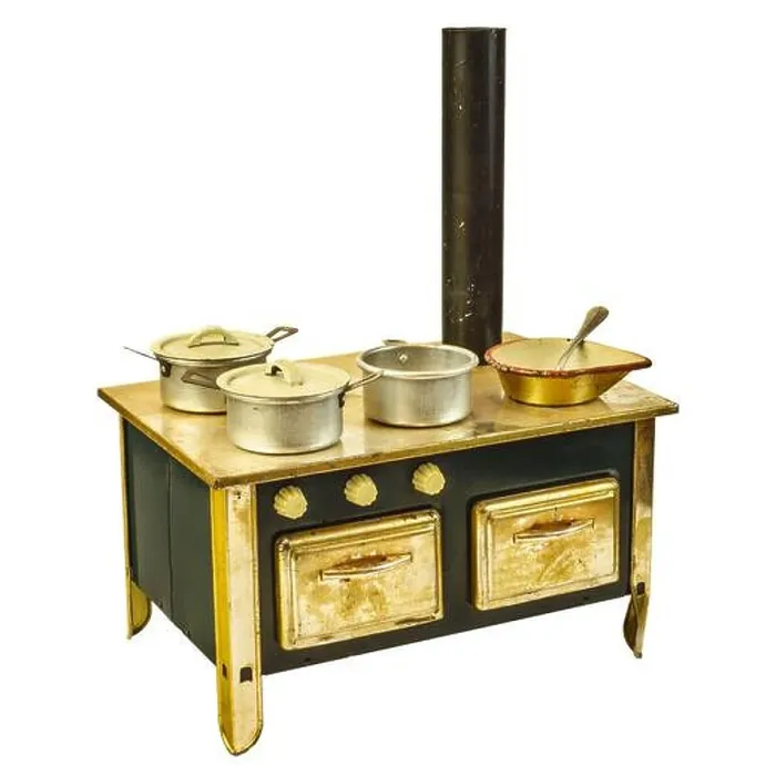 Framed Print : Vintage doll house cooking stove with pans isolated on a white background Framed Print : Vintage doll house cooking stove with pans isolated on a white background