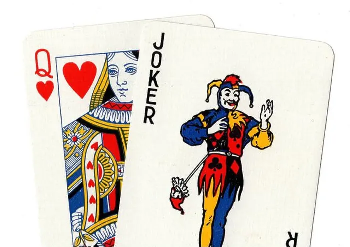 Framed Print : Vintage playing cards showing a joker and a queen of hearts on a white background Framed Print : Vintage playing cards showing a joker and a queen of hearts on a white background