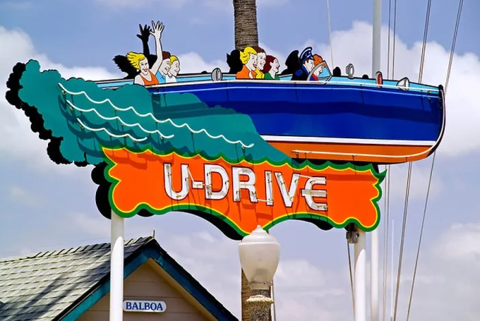 Framed Print : A vintage 'U-Drive' sign has been restored with fresh paint to advertise rentals for boating around Newport Harbor Framed Print : A vintage 'U-Drive' sign has been restored with fresh paint to advertise rentals for boating around Newport Harbor