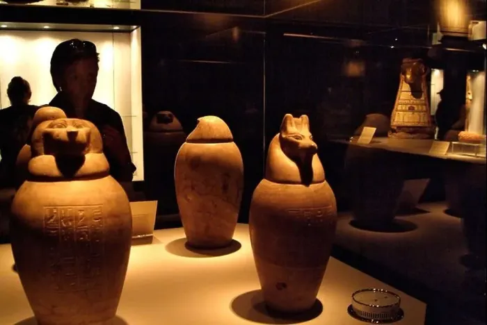 Framed Print : Visitor looking at coptic jars, Mummification Museum, Luxor, Egypt - High ISO Image Framed Print : Visitor looking at coptic jars, Mummification Museum, Luxor, Egypt - High ISO Image