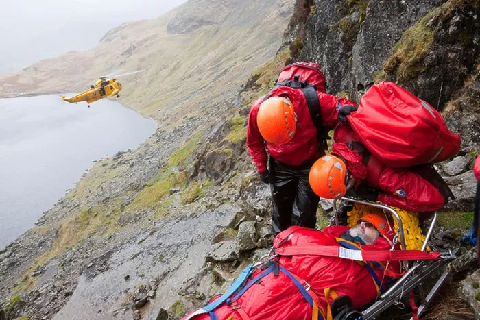 Framed Print : A walker with a compound leg fracture is treated by Langdale / Ambleside Mountain Rescue Team on Pavey Ark in the Lake Framed Print : A walker with a compound leg fracture is treated by Langdale / Ambleside Mountain Rescue Team on Pavey Ark in the Lake