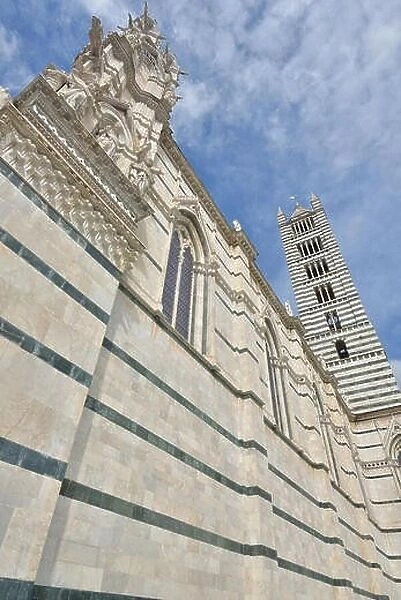 Walls and tower of the Siena Cathedral, region of Tuscany, Italy. Siena Dome
