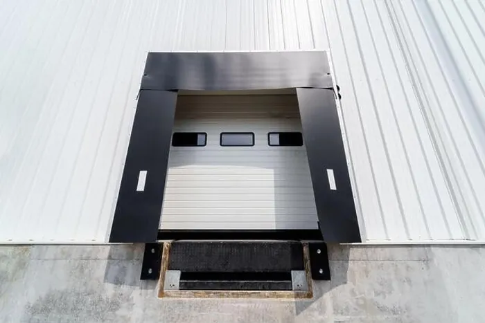 Framed Print : Warehouse gate for loading and unloading cargo in a distributed center Framed Print : Warehouse gate for loading and unloading cargo in a distributed center