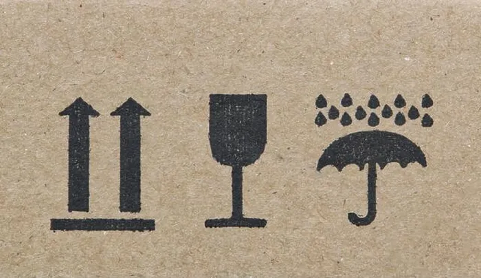 Framed Print : Warning labels on cardboard box silhouette shapes umbrella glass arrows Framed Print : Warning labels on cardboard box silhouette shapes umbrella glass arrows