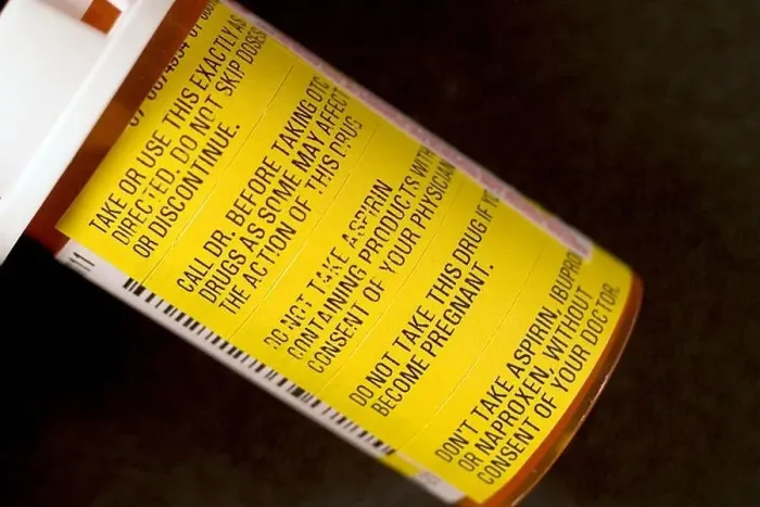 Framed Print : Warning labels on prescription medicine bottle Framed Print : Warning labels on prescription medicine bottle