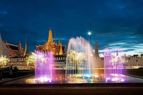 Wat phra kaew with colorful fountain at night in Bangkok, Thailand. Beautiful temple in Bangkok, Thailand