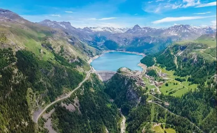 Framed Print : Water dam and blue reservoir lake aerial overview in Alps mountains in summer generating hydroelectricity Framed Print : Water dam and blue reservoir lake aerial overview in Alps mountains in summer generating hydroelectricity