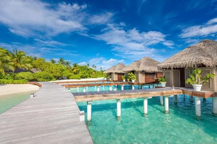 Framed Print : Water Villas bungalows on the perfect tropical Island, beautiful white sand on tropical beach blue water blue sky with coconut palm, Maldives islands Framed Print : Water Villas bungalows on the perfect tropical Island, beautiful white sand on tropical beach blue water blue sky with coconut palm, Maldives islands