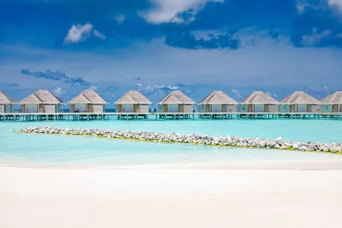 Framed Print : Water villas on tropical paradise island, Maldives. Beach with racks and white sand. Luxury summer travel vacation destination. Relaxing beach scenery Framed Print : Water villas on tropical paradise island, Maldives. Beach with racks and white sand. Luxury summer travel vacation destination. Relaxing beach scenery