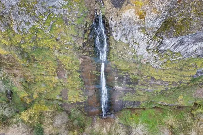 Framed Print : A waterfall flows over a cliff into the Columbia River Gorge in Oregon. This canyon, with the Columbia River flowing through it, is 80 miles long Framed Print : A waterfall flows over a cliff into the Columbia River Gorge in Oregon. This canyon, with the Columbia River flowing through it, is 80 miles long