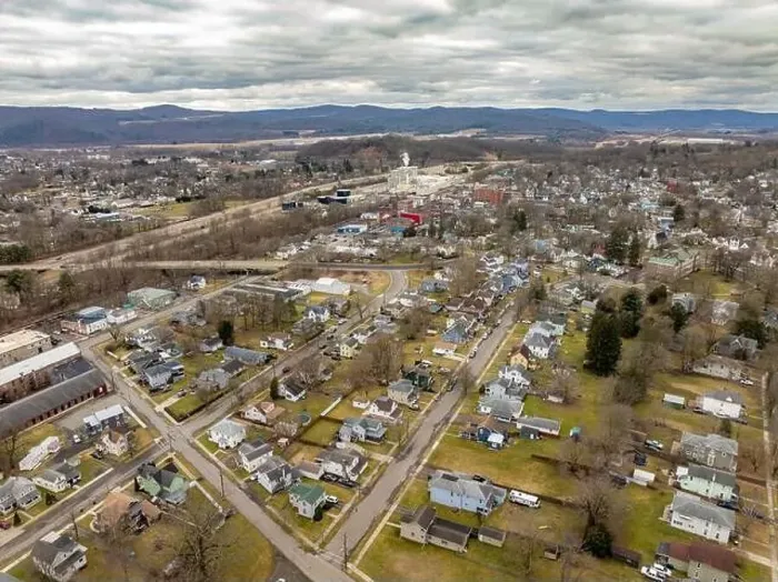 Framed Print : Waverly, NY, USA - 03-03-2024 - Cloudy winter aerial image of the downtown area in the Village of Waverly, NY