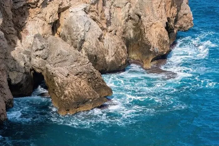 Framed Print : Waves of a deep blue sea crashing against the rocks in Antalya Turkey Framed Print : Waves of a deep blue sea crashing against the rocks in Antalya Turkey