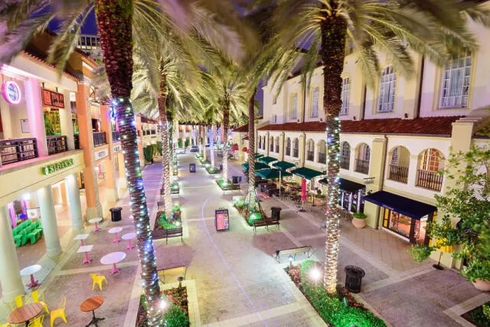 Framed Print : WEST PALM BEACH, FLORIDA - APRIL 3, 2016: Palm trees line CityPlace at night. The mixed-use development was finished in 2000 Framed Print : WEST PALM BEACH, FLORIDA - APRIL 3, 2016: Palm trees line CityPlace at night. The mixed-use development was finished in 2000