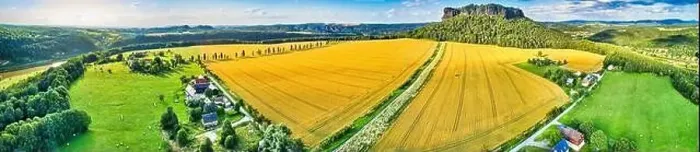 Framed Print : Wheat fields in Germany, aerial photography with mountains in the background Framed Print : Wheat fields in Germany, aerial photography with mountains in the background