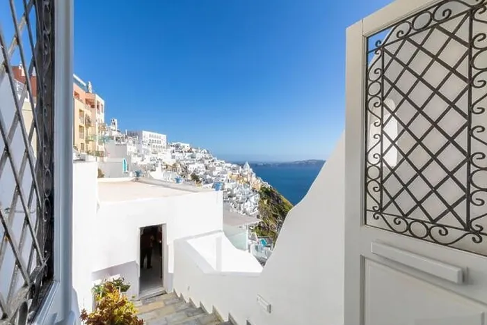 Framed Print : White architecture on Santorini island, Greece. Beautiful landscape, sea view. White wash staircases on Santorini Island, Greece. The view off Caldera Framed Print : White architecture on Santorini island, Greece. Beautiful landscape, sea view. White wash staircases on Santorini Island, Greece. The view off Caldera