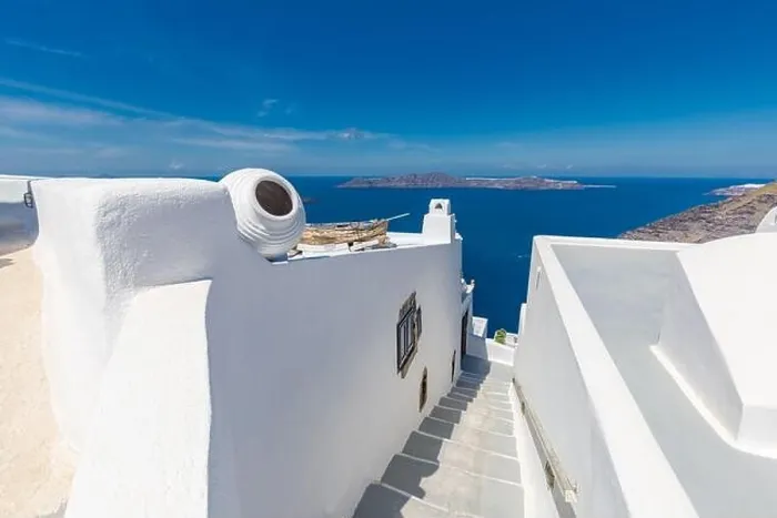 Framed Print : White architecture on Santorini island, Greece. Beautiful landscape, sea view. White wash staircases on Santorini Island, Greece. The view off Caldera Framed Print : White architecture on Santorini island, Greece. Beautiful landscape, sea view. White wash staircases on Santorini Island, Greece. The view off Caldera