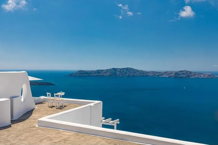 Framed Print : White architecture on Santorini island, Greece. Outdoor restaurant under a fantastic landscape, chairs for couple. Romantic view, summer vacation Framed Print : White architecture on Santorini island, Greece. Outdoor restaurant under a fantastic landscape, chairs for couple. Romantic view, summer vacation